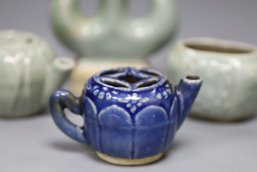 Three Chinese celadon miniature ornaments and a blue glazed teapot, largest 10cm